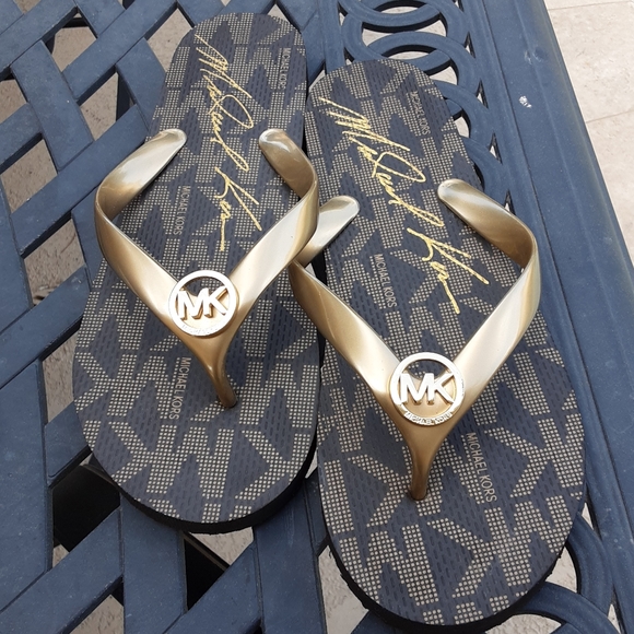 Michael Kors Shoes - Michael Kors brown & gold flip flops size 8 EUC